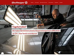 Website von Heuberger mit Hinweis auf Hagelschaden-Reparatur